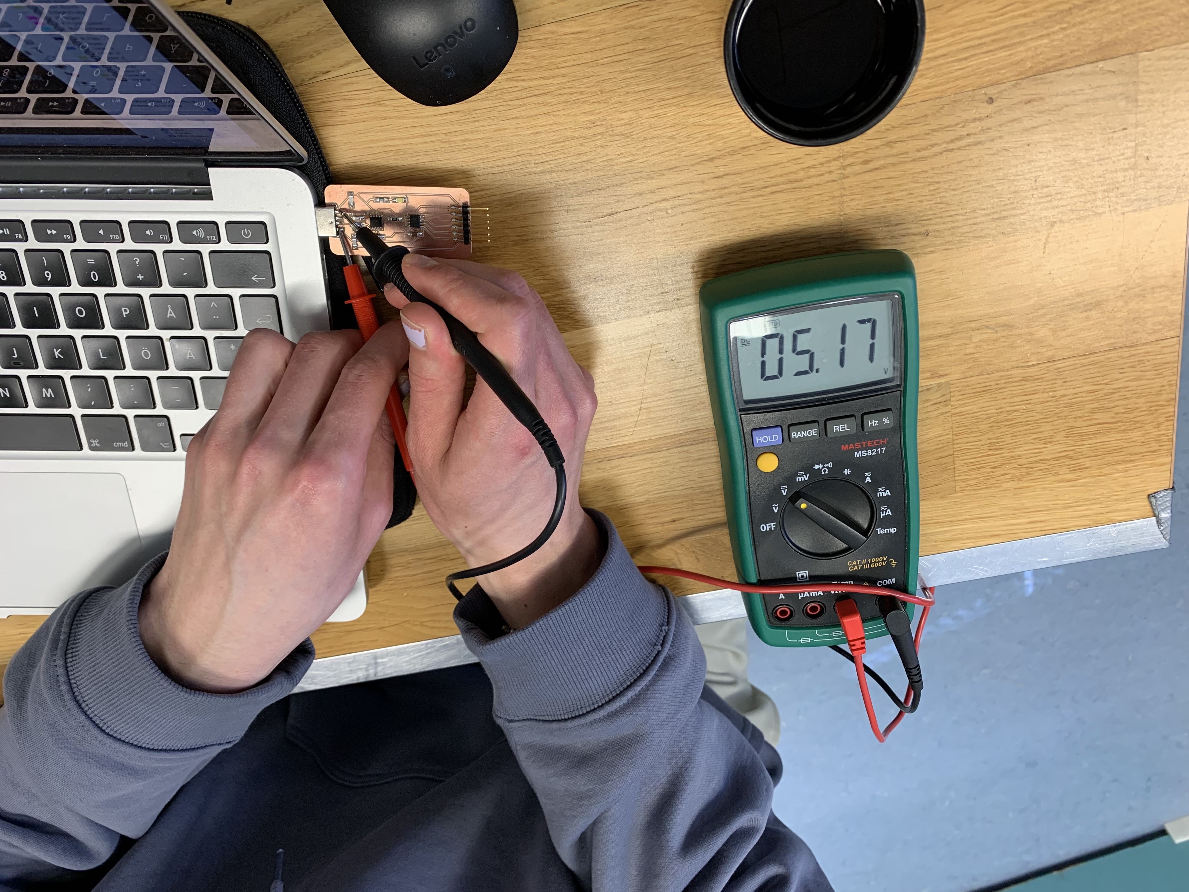 Multimeter being used to measure voltage
