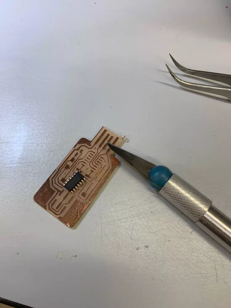 Scraping the excess copper off the USB connector